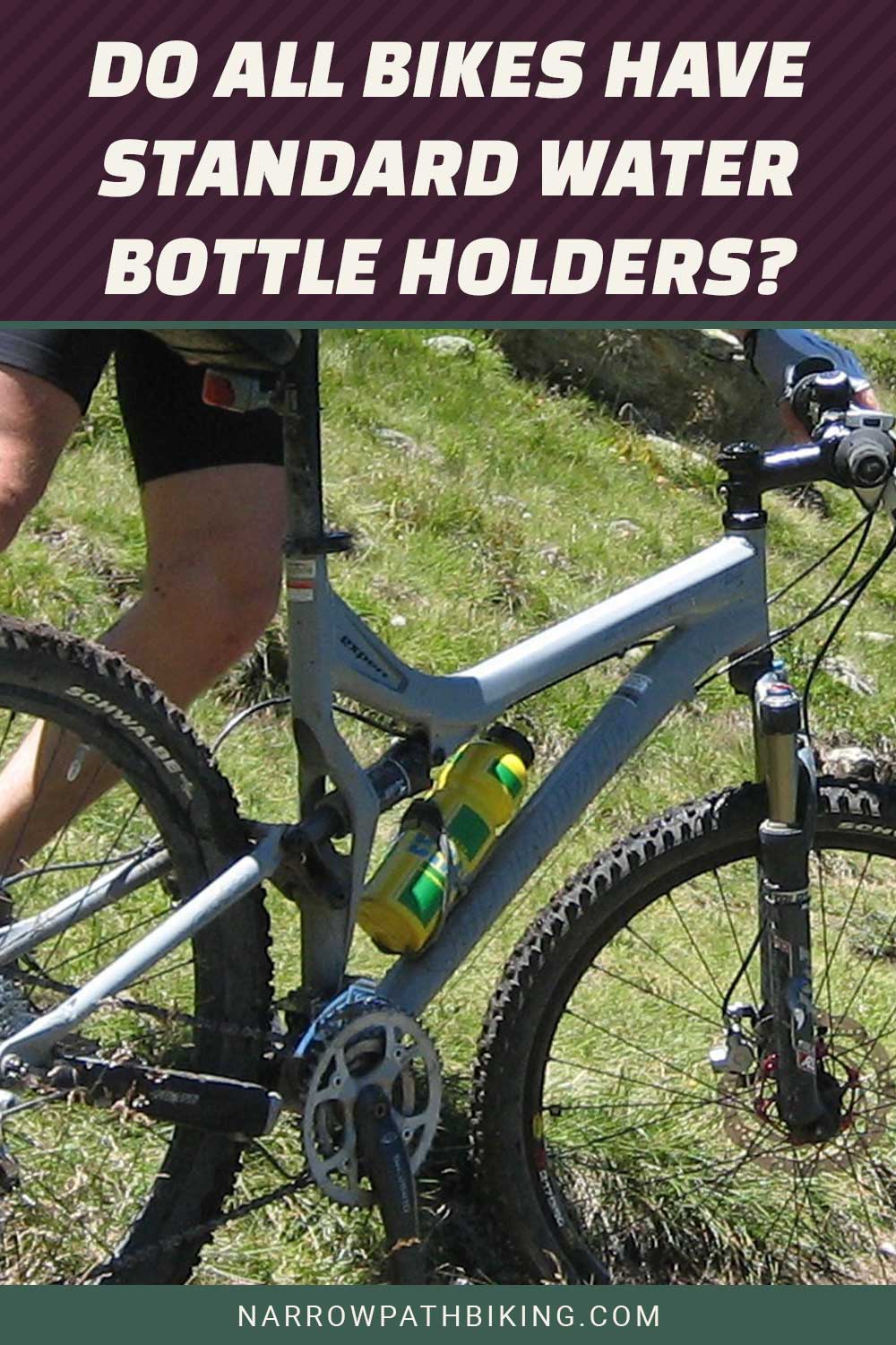 A mountain bike and a man standing beside it - Do all bikes have standard water bottle holders?